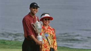 Tiger Woods from the United States stands alongside his mother Kultida Woods holding the United States Golf Association Open Championship trophy after winning the 100th United States Open golf tournament on 18th June 2000.