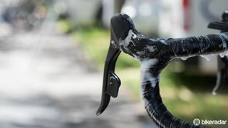 SRAM has apparently abandoned its long-running DoubleTap style of shifter operation on the new wireless electronic group in favor of a new one-button-per-side format called 'eTap'. Tap the left lever to downshift and the right one to move to harder gears. Push both to initiate a front shift