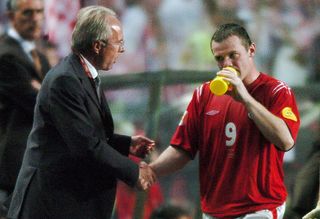 LISBON, Portugal: England manager Sven Goran Erikkson (R) shakes hands with Wayne Rooney after he was substituted, 21 June 2004 during their European Nations football championship match against Croatia at the Estadio da Luz in Lisbon. Croatia and England are competing in Group B with France and Switzerland. AFP PHOTO PAUL BARKER (Photo credit should read PAUL BARKER/AFP via Getty Images)