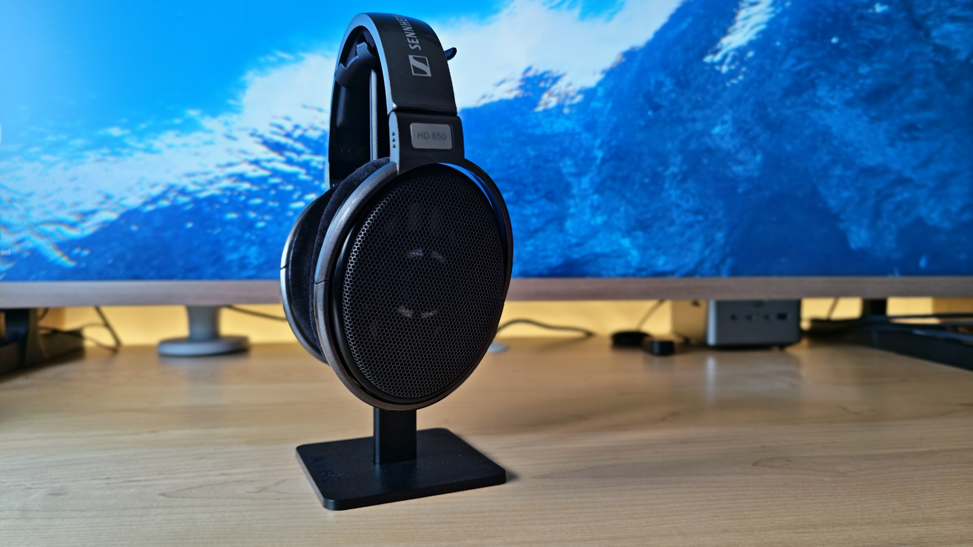 A selection of photos of the HD 650 headphones in a home office.