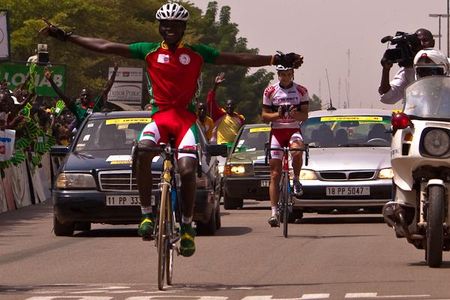 In a tremendous gesture of sportsmanship, Christophe Premont applauds as Abdoul Aziz Nikieme wins the final stage of the 2010 Tour du Faso.