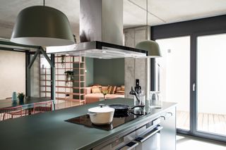 green kitchen area with pendent lights at BaseCamp student accommodation