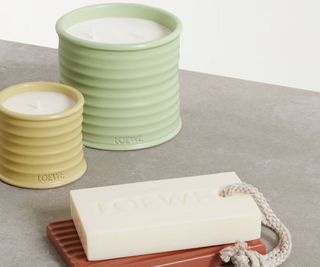 Loewe candles and a soap on a ocuntertop