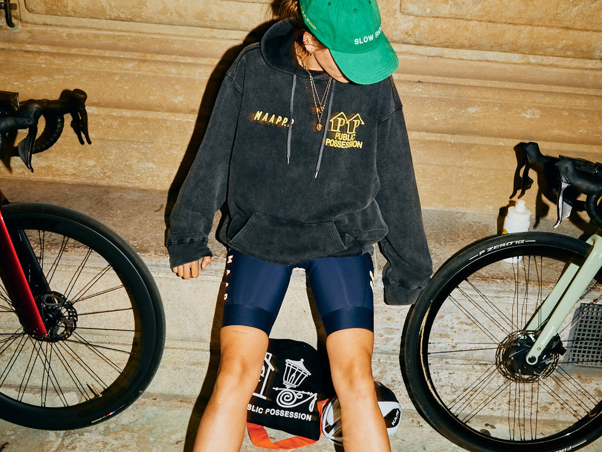 A woman wearing a MAAP hoodie