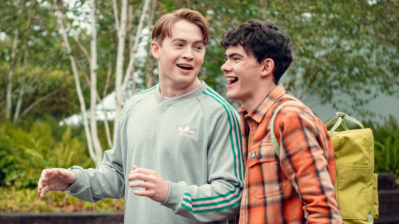 Kit Connor as Nick and Joe Locke as Charlie, talking outdoors, in &#039;Heartstopper&#039; season 3.