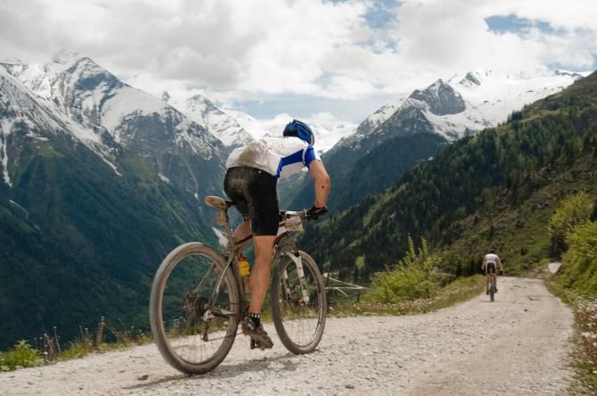 A rider powers up a tough gravel climb during the Bike Four Peaks