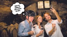 Dr Hutch wears a helmet and tastes wine in a group