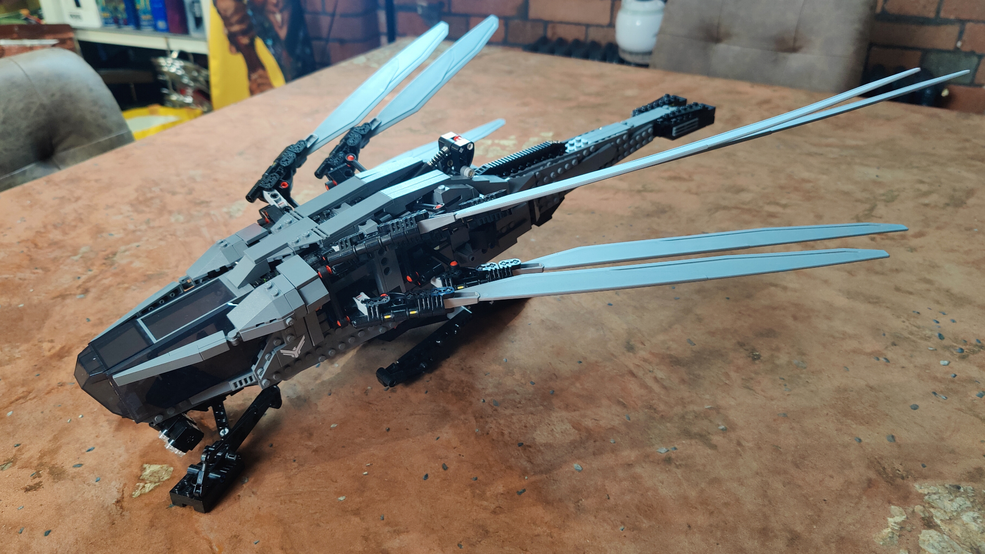 The completed Lego Ornithopter with the wings folded half-way back.