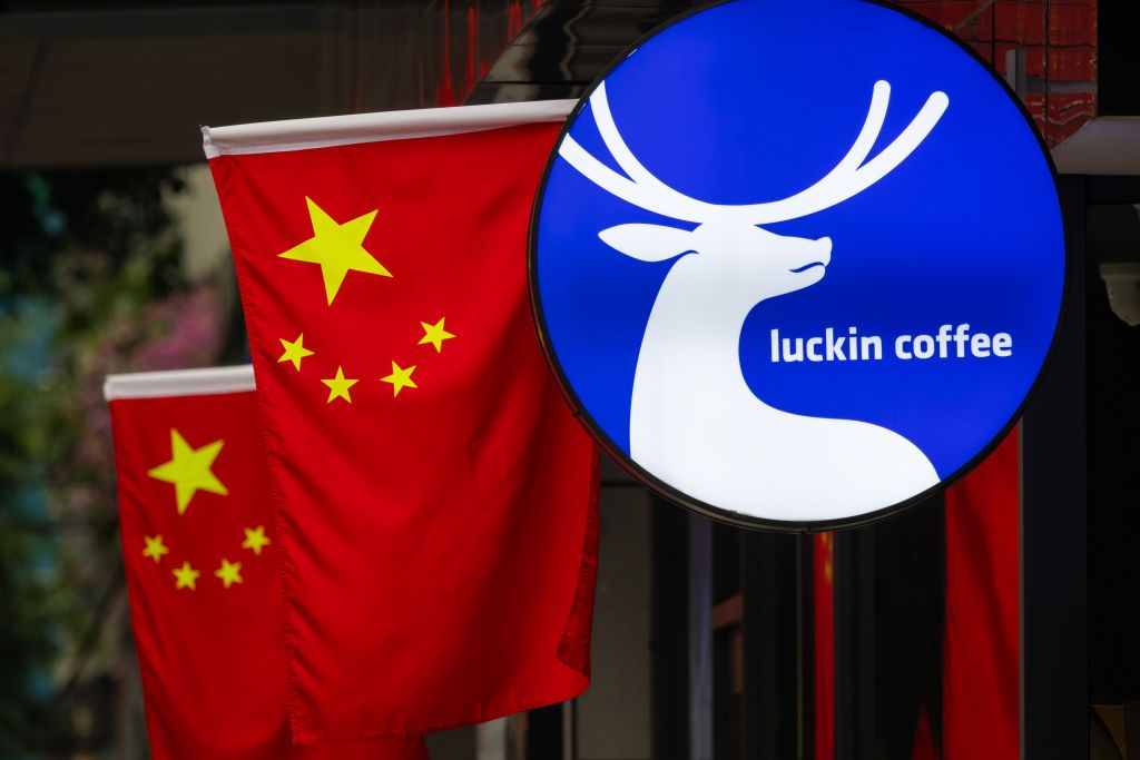 Chinese Flags and Chinese consumer brand Luckin Coffee Sign in Chengdu