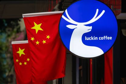 Chinese Flags and Chinese consumer brand Luckin Coffee Sign in Chengdu