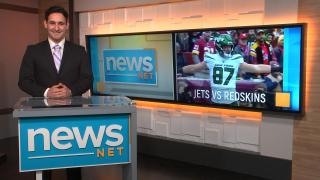Derek Tate anchors a sports broadcast on NewsNet's new set.