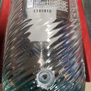 bottle with drill hole