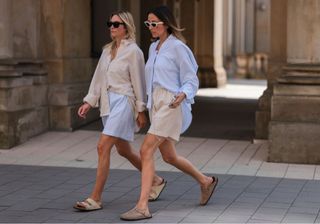 Fashion Week attendees wear shorts and button-down shirts