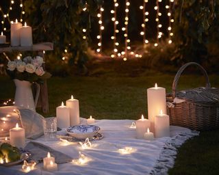 outdoor candles from lights4fun at garden picnic