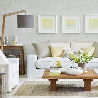 living room with sofa set and floor lamp