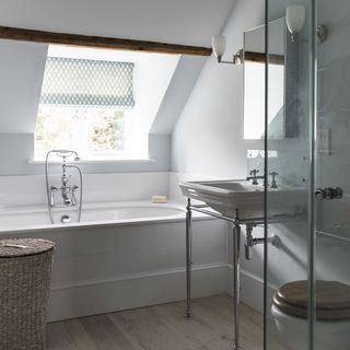 kids bathroom with wooden flooring and white bathtub