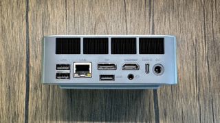 Beelink SER9 Mini PC on a wood background