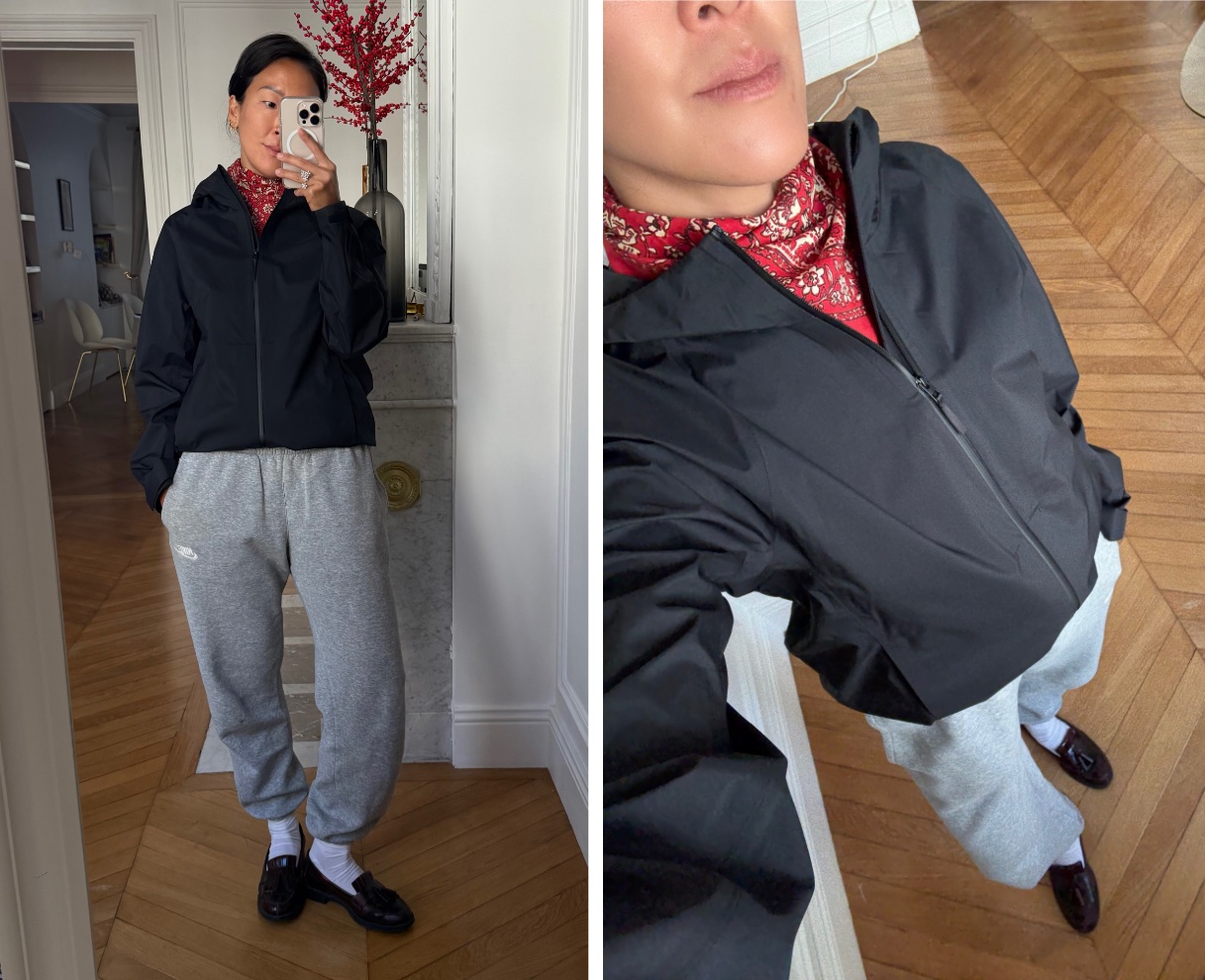 Irene Kim wearing a black windbreaker, sweatpants, loafers, socks, and a bandana