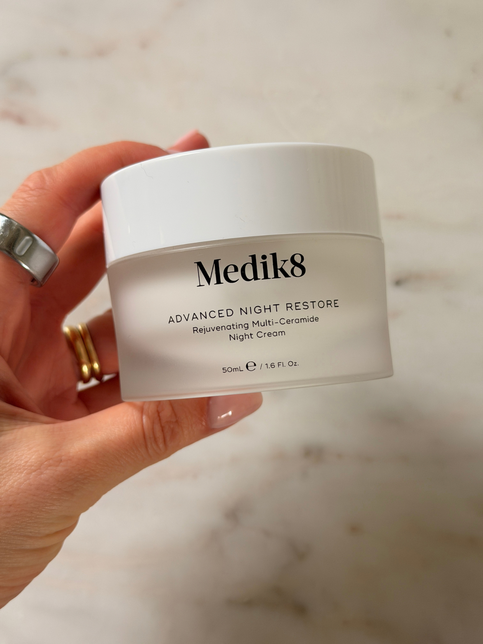 Freelance beauty editor Grace Day holding the Medik8 moisturiser