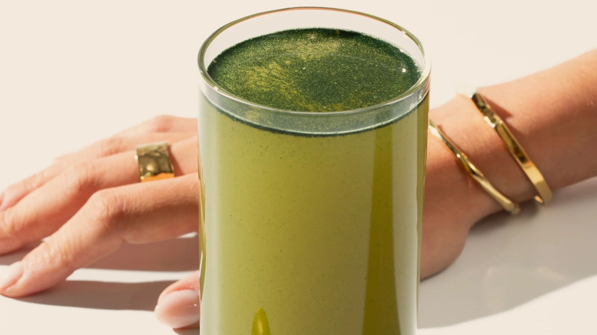 glass of free soul greens powder drink