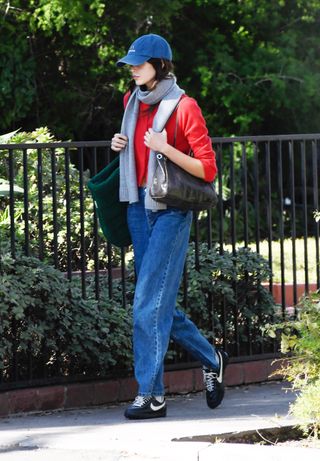 Kaia Gerber walking in LA wearing baggy jeans and Nike sneakers