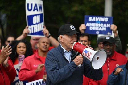 Biden addresses striking members of the United Auto Workers (UAW) union at a picket line 