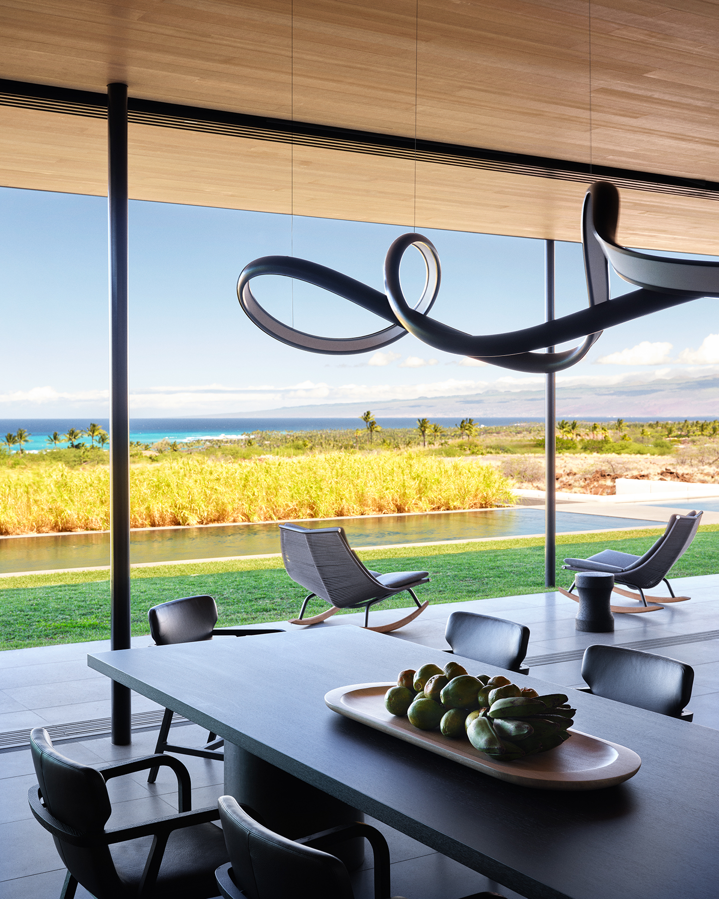 Hawaii house by oslon kundig and leverone design by the sea, tall ceilings, contemporary spaces and art work, and lots of glazing