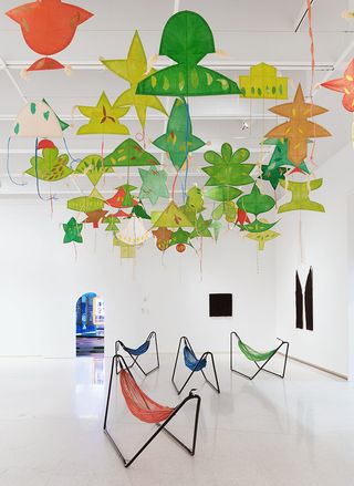 the installation is crowned by traditional Vietnamese kites