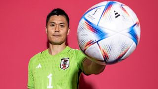 Eiji Kawashima of Japan with the world cup ball