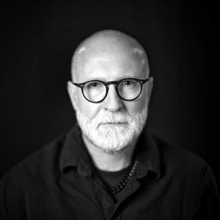 A portrait of Bob Mould in black and white