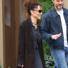 Zoe Kravitz wears capri pants with leopard-print heels with Jamie Dornan