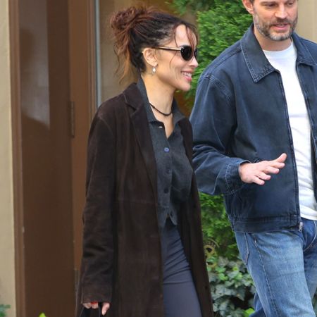 Zoe Kravitz wears capri pants with leopard-print heels with Jamie Dornan
