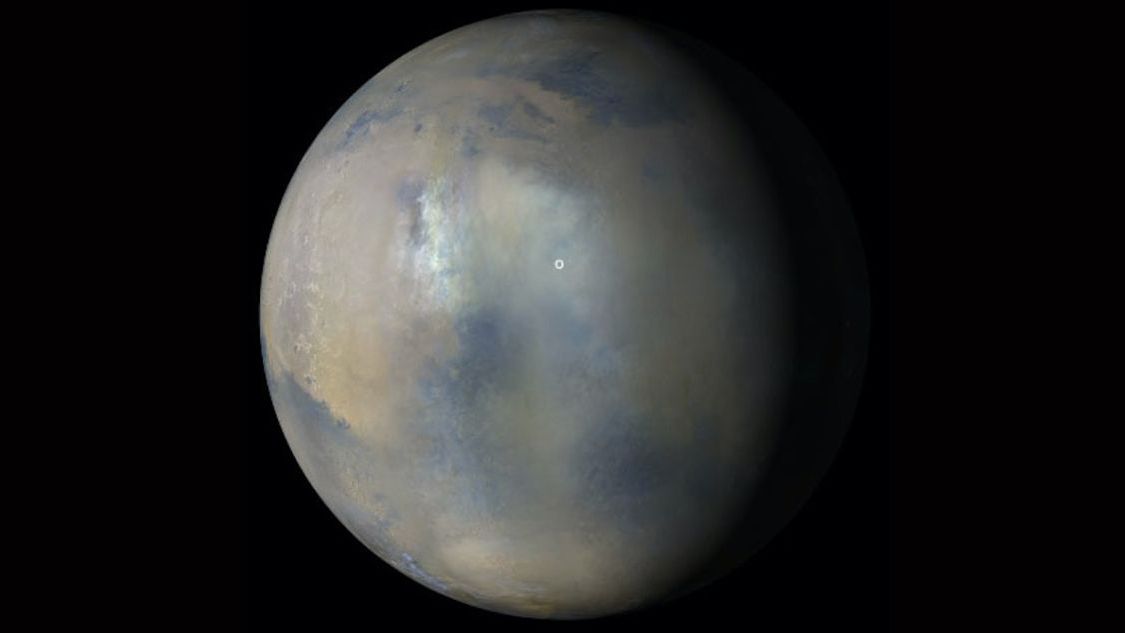 Images acquired Jan. 9, 2022, from the Mars Color Imager instrument on NASA&#039;s Mars Reconnaissance Orbiter were combined to create this view showing the presence of a regional dust storm obscuring the location of Perseverance rover and Ingenuity Mars Helicopter (white circle).