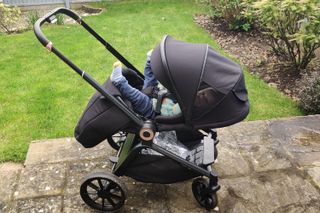 Our tester's baby in the Ickle Bubba Altima travel system