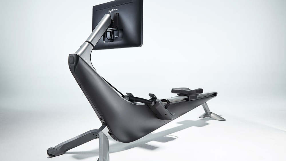 Hydrow rowing machine in studio, offset rear view