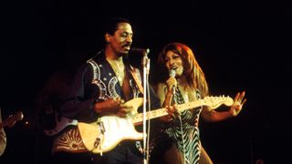 American music duo Tina Turner and Ike Turner (1931-2007) on left playing Fender Stratocaster guitar, of the Ike & Tina Turner Revue perform live on stage at the Hammersmith Odeon in London on 24th October 1975