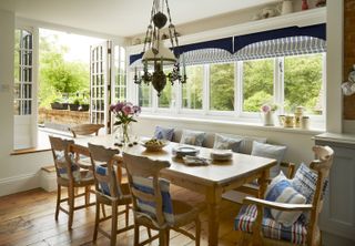 dining-area-with-french-doors-onto-garden-and-striped-blinds