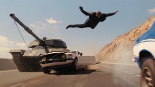 Rome jumping off a tank and onto a car in Fast and Furious 6