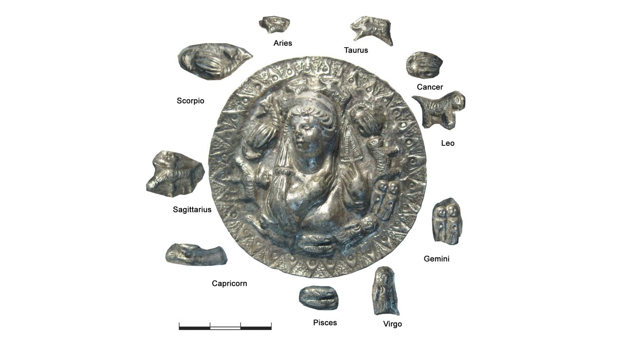 The portrait of Aphrodite is surrounded by symbols for 10 signs of the zodiac, but there are no symbols for Aquarius or Libra.