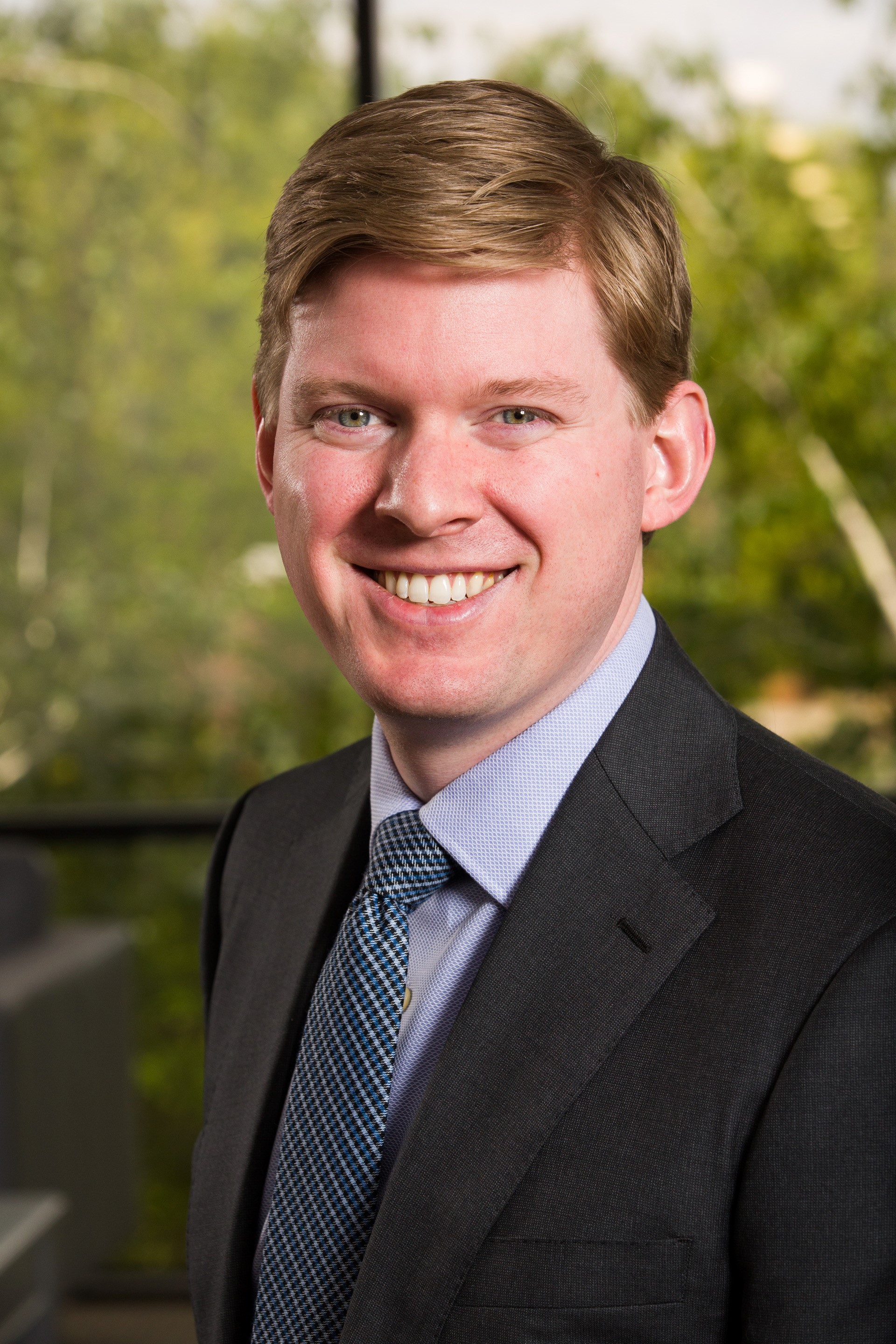 Smiling headshots of Kasey Kaumans and Robert Luckey.