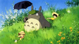 Totoro in a field with an animated character