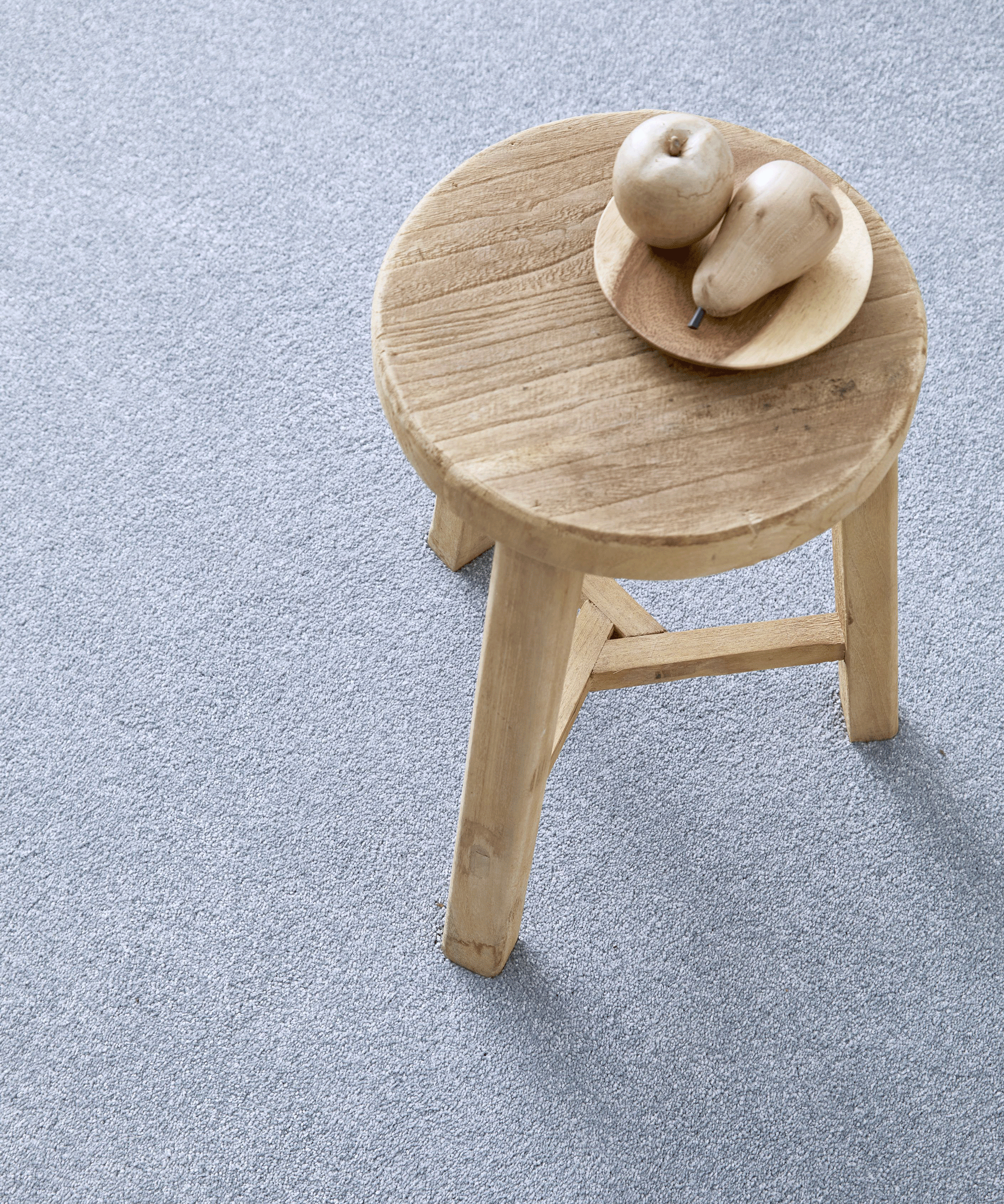 grey carpet and wooden stool