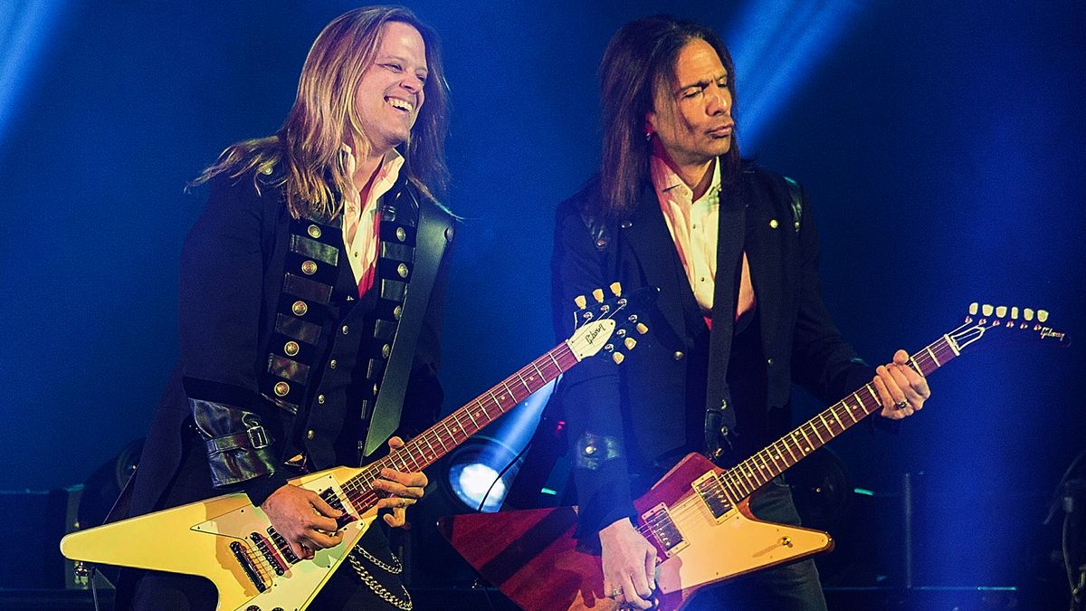 Angus Clark (L) and Al Pitrelli of Trans-Siberian Orchestra perform onstage at Viejas Arena on November 28, 2014 in San Diego, California.