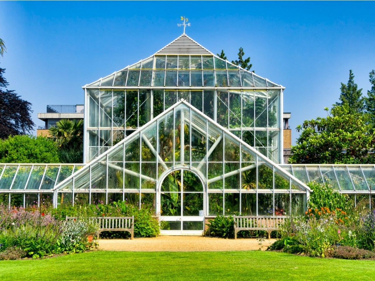 An exterior view of a beautiful greenhouse in a botanical garden