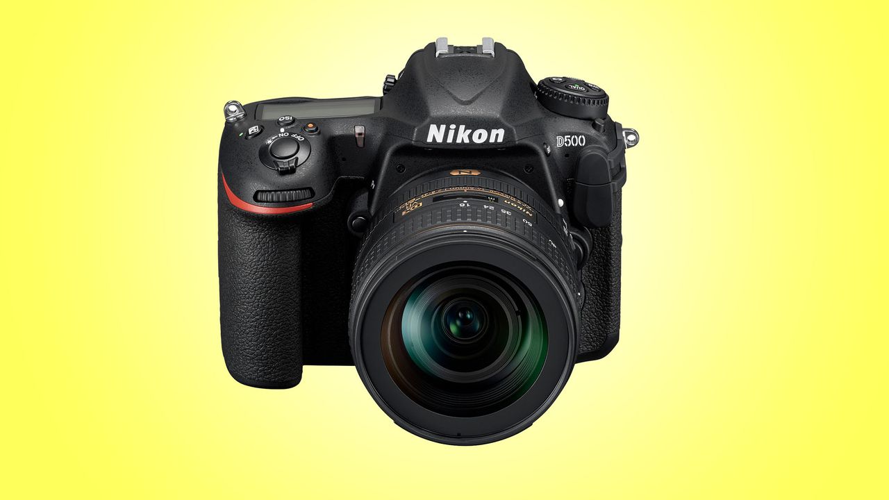 A Nikon D500 product shot on a yellow background