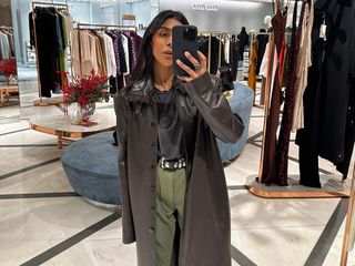 Monikh taking a mirror selfie in a department store