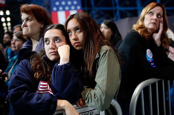 Hillary Clinton supporters comfort each other.