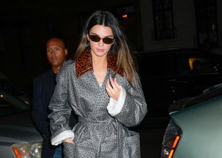 Kendall Jenner in sunglasses walking