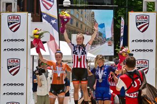 Emma White stands on the top step of the U23 podium after the US road race championship