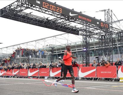 Olympic marathon champion Eliud Kipchoge crosses the finish line